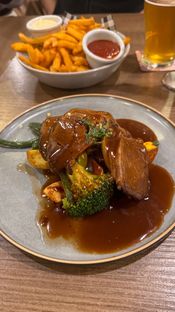 A plate of lambroast and vegetables